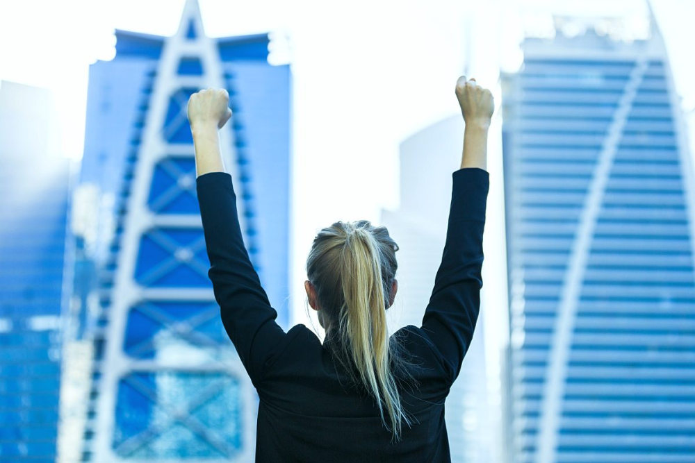 Businesswoman celebrating success | Data-Backed Sales Best Practices | sales force best practices