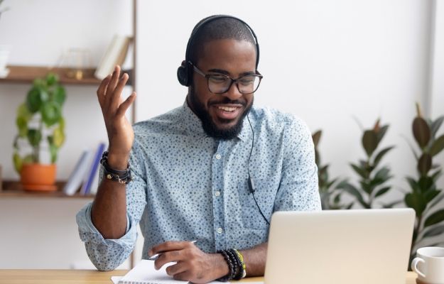 a business man making a phone call on computer | Read subtle cues